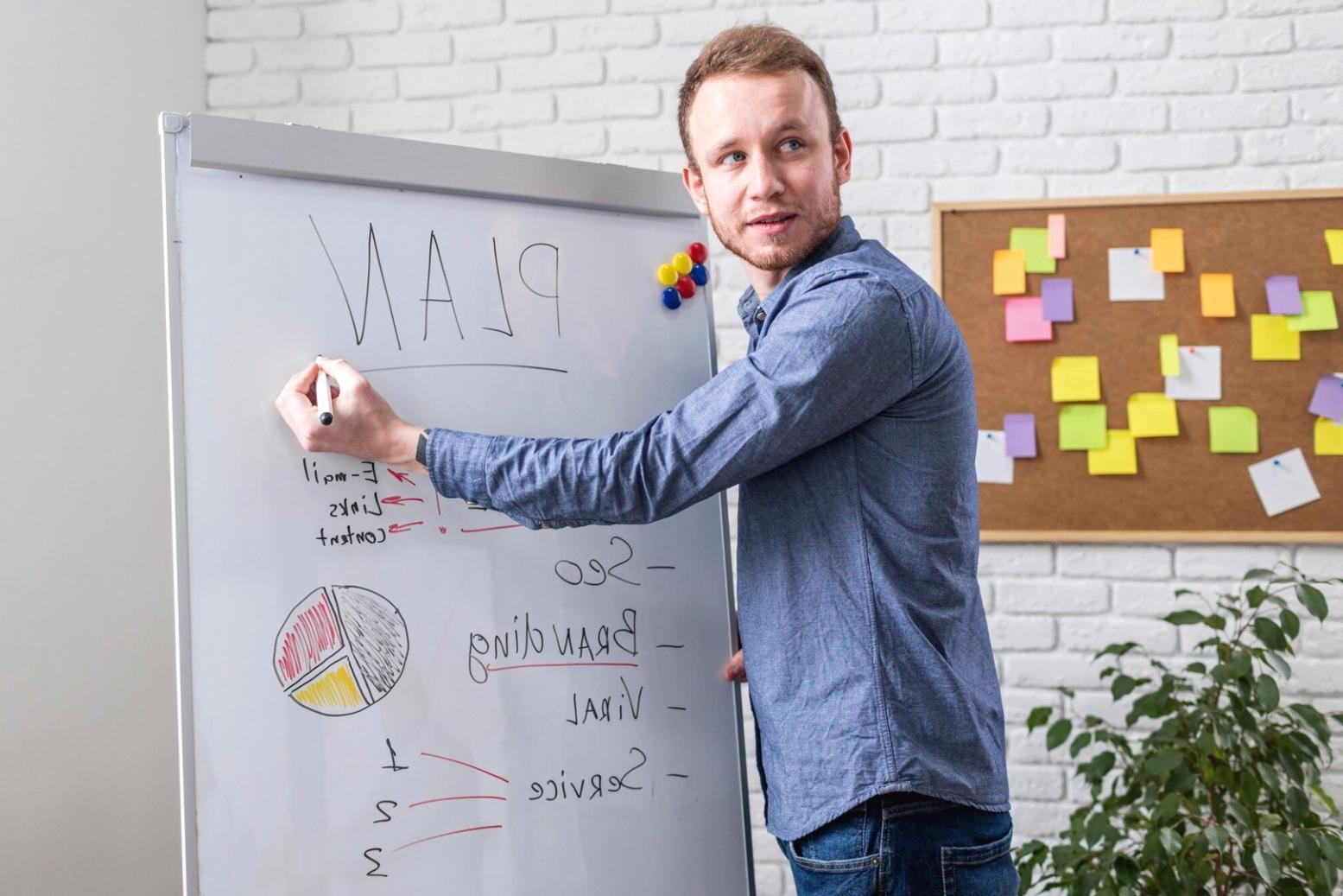 Parent and child looking at savings jar with coins and notes