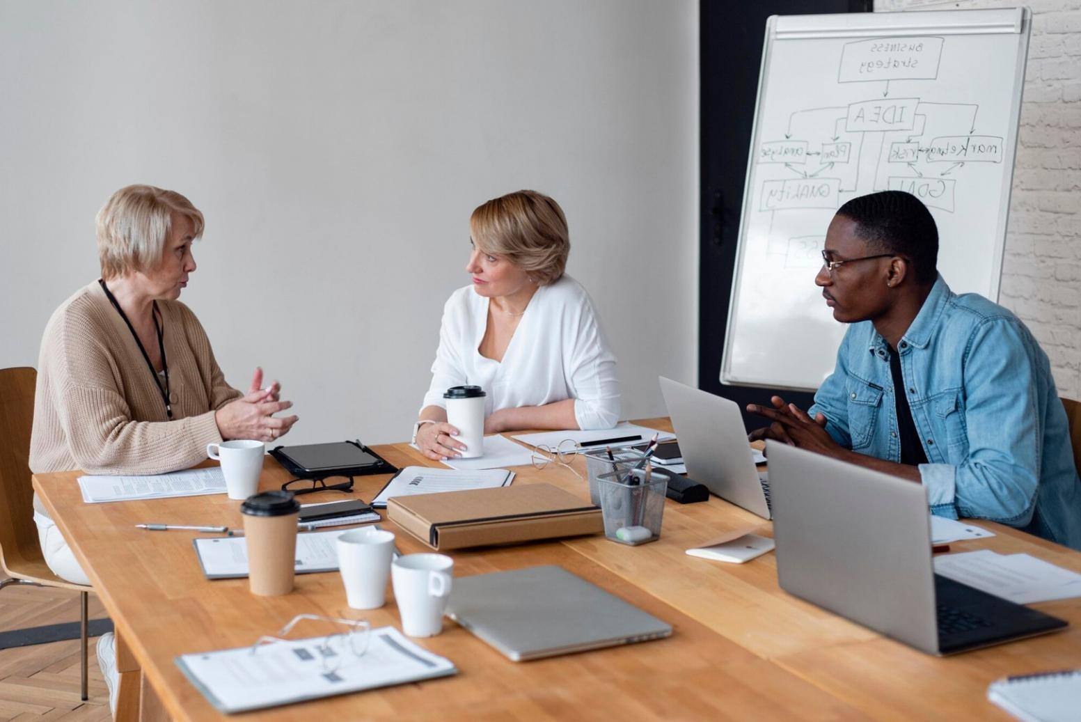Calculator and financial planning worksheets spread on desk