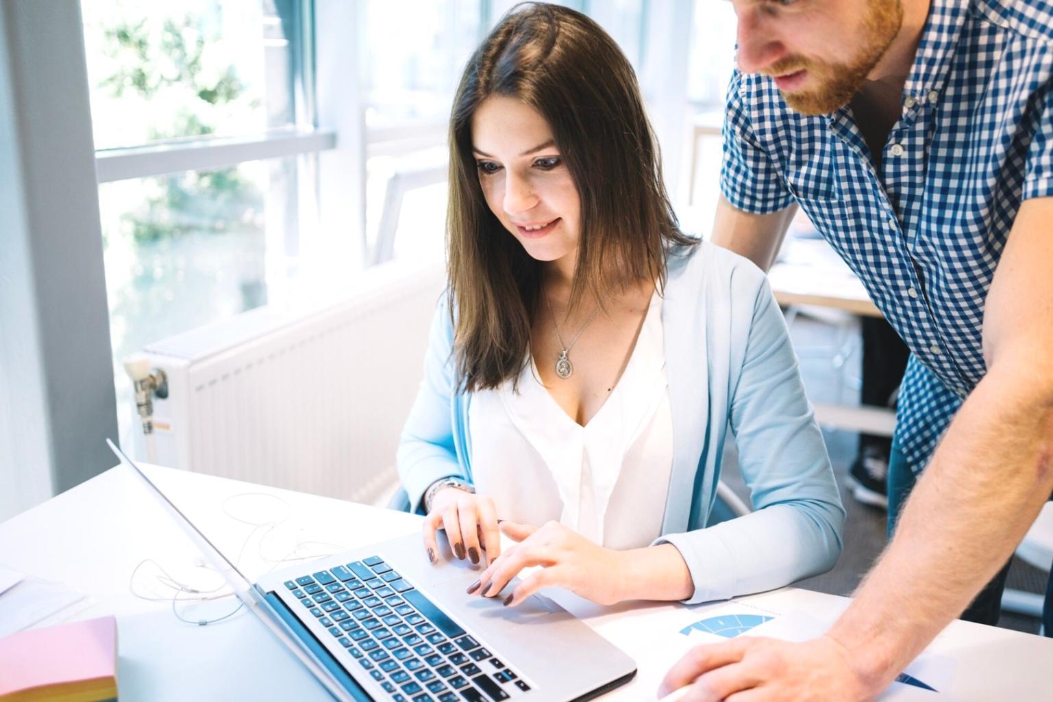 Modern family reviewing household budget together at kitchen table